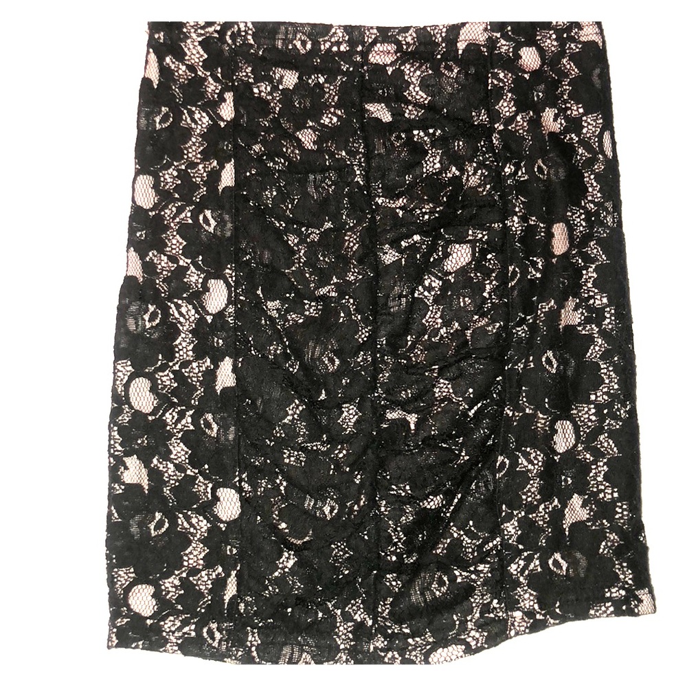 Black lace on top of a light pink mini skirt